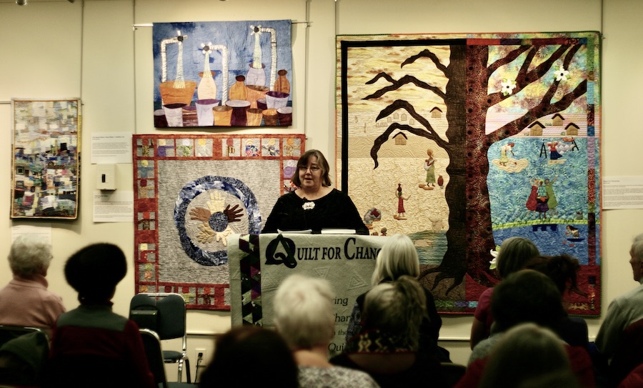 Allison Wilbur giving remarks at the opening of the Water is Life Exhibit at the New England Quilt Museum