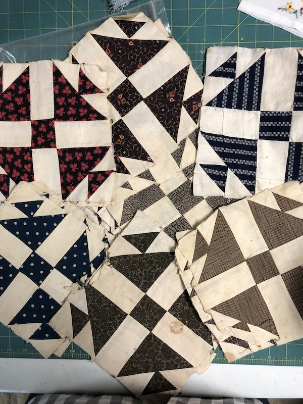 Antique Shoofly Quilt blocks from the 1860s. The patchwork block are in cream fabric and earth toned fabrics and are hand pieced.