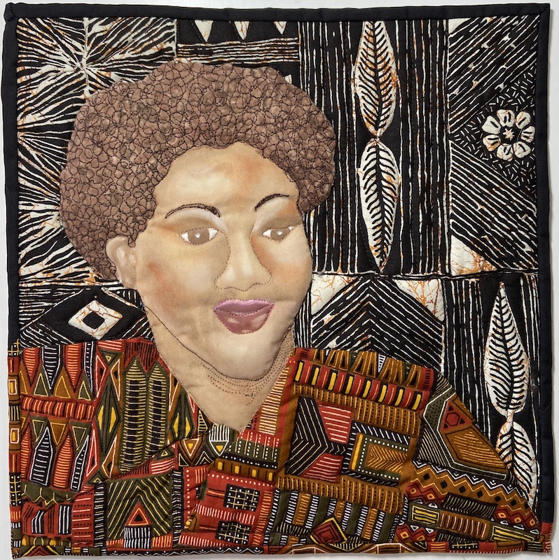 Mini art quilt portrait of African Woman