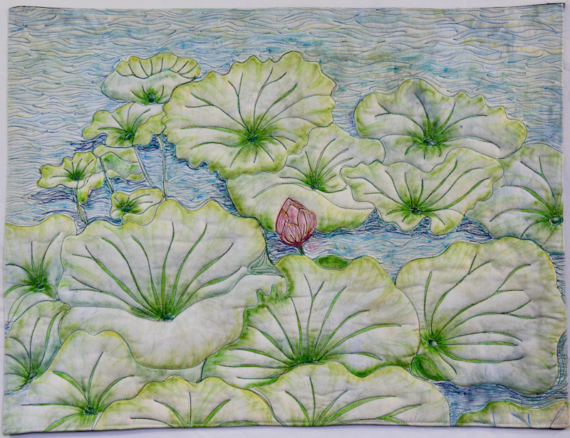 small art quilt by Allison Wilbur of water lily pads and lotus bud.